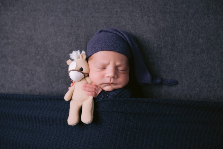 Newborn portrait sessions are the perfect collection to add a high-end photo album to!
